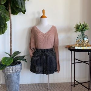 Lightweight off the shoulder knit sweater with an open back.